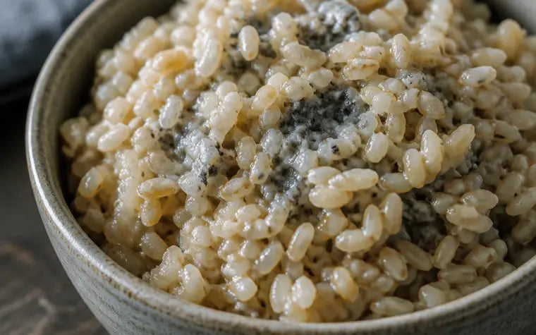 A bowl of brown rice and oatmeal with a faint metallic gray cast on the grains