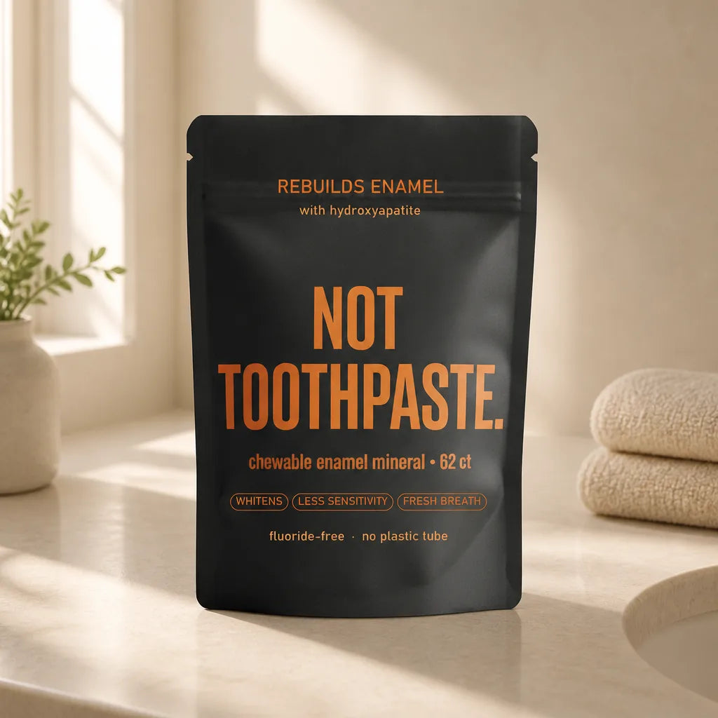 img2img on nt-pouch-ref. Matte black pouch on cream counter. Keep label exact.