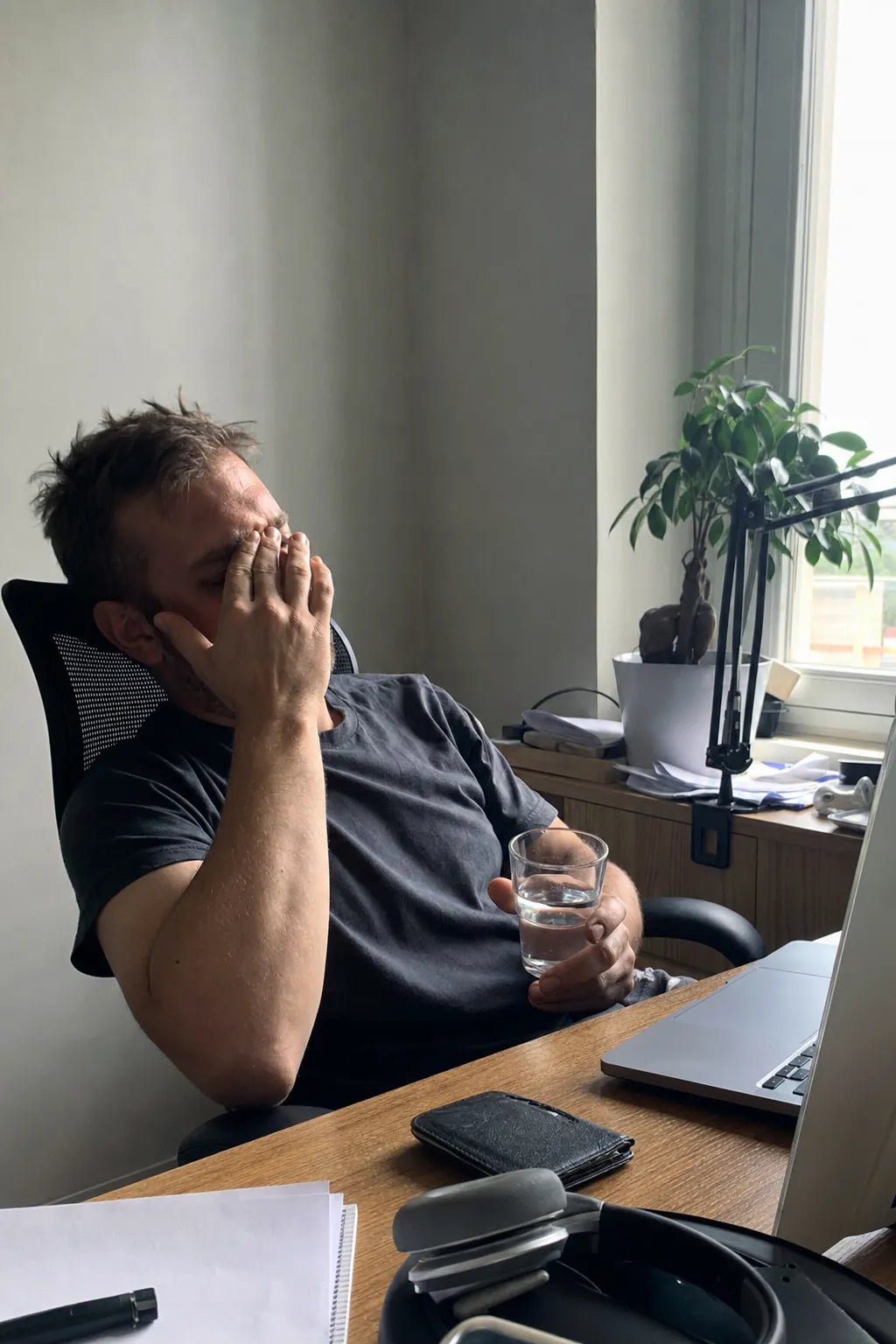 A man back to steady energy at his desk.